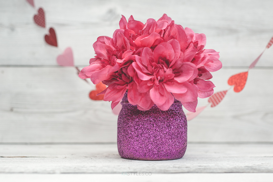Glitter Valentine's Day mason jar vases for decor or gifts.