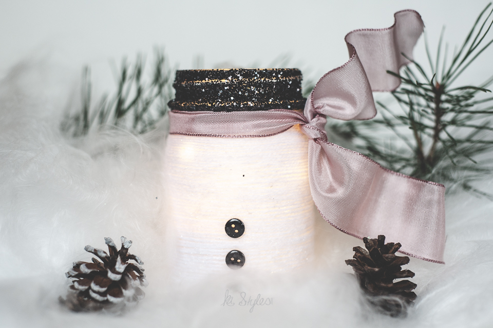 Yarn wrapped snowman mason jar luminary.