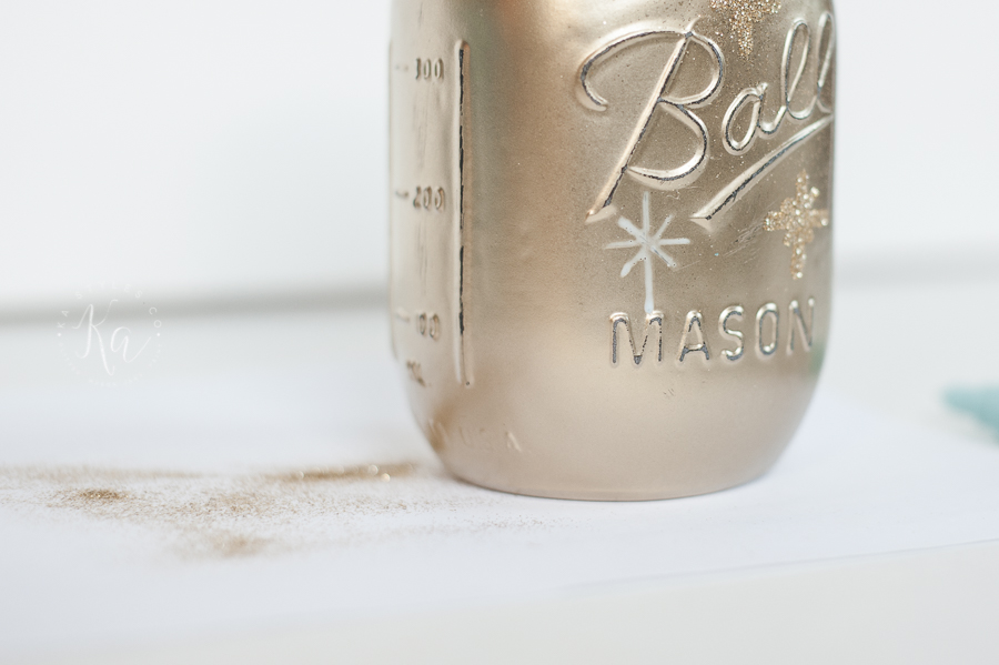 DIY Gold painted mason jar with gold glitter stars for Christmas or New Years. Cute luminary.
