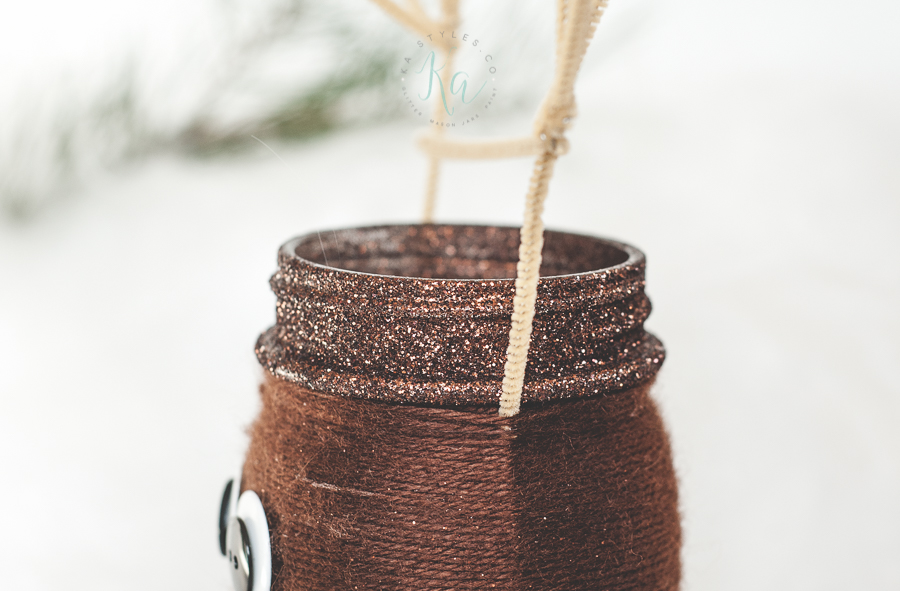 Yarn wrapped reindeer mason jar.