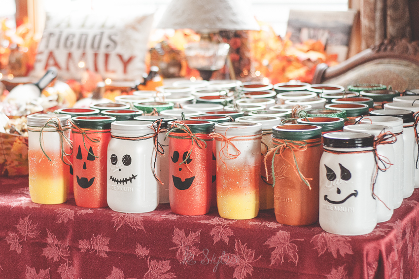 Halloween candy table. Candy corn, pumpkin and ghost mason jars.